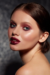 Beauty face makeup. Girl model with glamorous make-up portrait