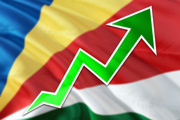 Seychelles economy graph is indicating positive growth, green arrow going up with trend line. Business concept on national background.