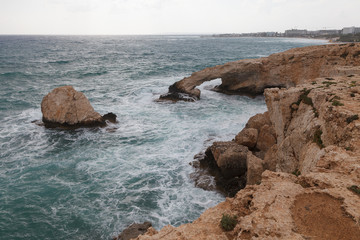 Rocky shore of Cyprus with waves crashing
