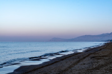 Fototapeta premium Early morning light during sunrise over Tyrrhenian sea near Sperlonga and Terracina, Lazio, Italy