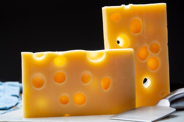Two blocks of French emmental semi-hard cheese