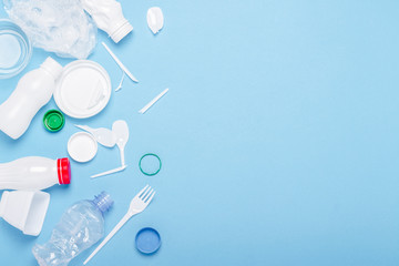 Garbage collection, plastic on a blue background. Concept stop plastic, recycling, separate...