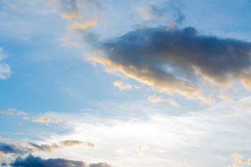 Naklejka na ściany i meble Sunset And a gray cloud with a blue sky