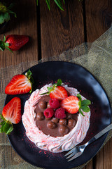 light pavlova with fresh fruits and chocolate