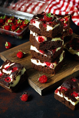 Naklejka na ściany i meble Brownies tower with cottage cheesecake and raspberries