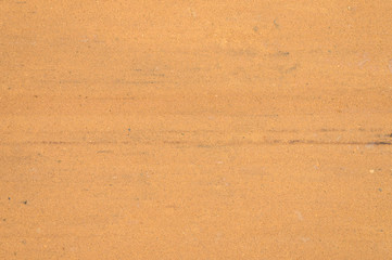 Fototapeta na wymiar Textured sand surface as background, top view