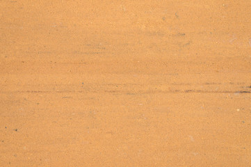 Textured sand surface as background, top view