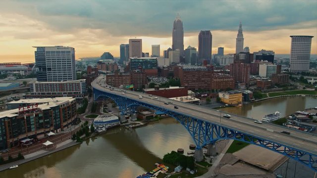 Morning aerial drone shot of downtown Cleveland, Ohio skyline with traffic on bridge leading into downtown