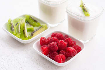 Natural yogurt with fresh raspberries and kiwi