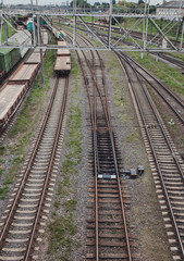 Fototapeta na wymiar View of the rails with freight trains. Railway