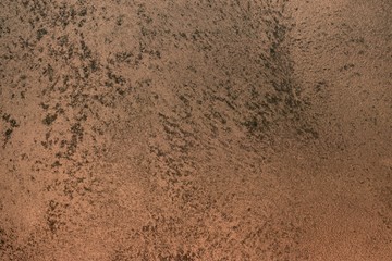 design grunge red rough painted metallic surface texture for design purposes.