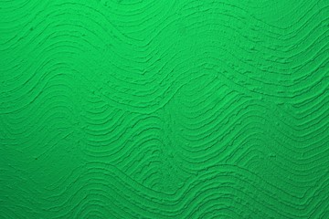 Fototapeta na wymiar green messy corrugated plaster on wall texture - fantastic abstract photo background