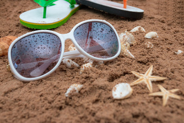 Summer beach sea accessories on sand beach, Summer background Holiday vacation travel concept