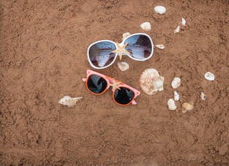 Summer beach sea accessories on sand beach, Summer background Holiday vacation travel concept