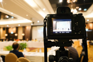 camera in business conference room recording participants and speaker echnology transformation of mirrorless camera.