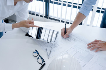 Colleagues interior designer Corporate Achievement Planning Design on blueprint Teamwork Concept...