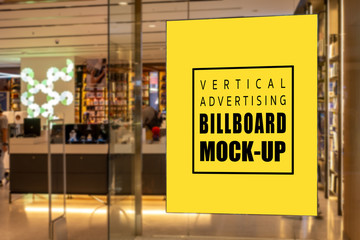 Mock up vertical signboard on glass panel of record store