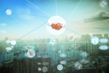 International Human Solidarity Day concept: handshake at blur city night and network connection background