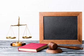 Scales of justice and gavel on wooden background. Copy space