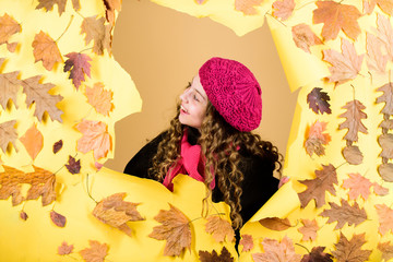 autumn beauty. Happy childhood. parisian kid in autumn leaves. child in positive mood. little girl...