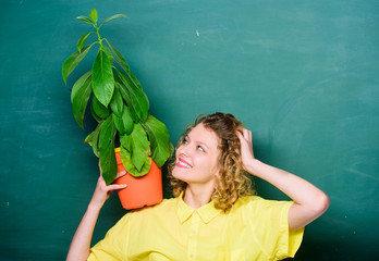 Easy houseplants. Take good care houseplants. Girl hold plant in pot. Floral shop. Botany is about...