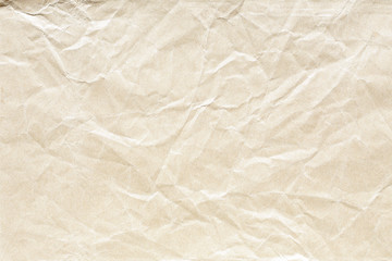 Old pale brown crumpled paper background texture