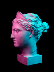 Gypsum copy of ancient statue Diana head isolated on black background. Plaster sculpture woman face.