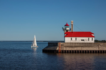 Lake Superior Lighthouse with a Sailboat