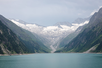 Obraz premium View of glacier and lake in the Alps near the border of Austria and Italy
