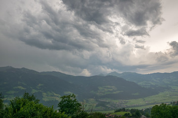 Obraz premium Dramatic sky of a thunderstorm cloud over the Alps, central Europe
