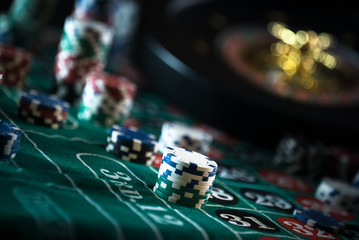 Roulette table and stack of poker chips, Casino, gambling and entertainment concept  photo
