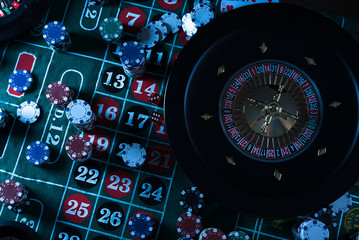 Roulette table and stack of poker chips, Casino, gambling and entertainment concept  photo