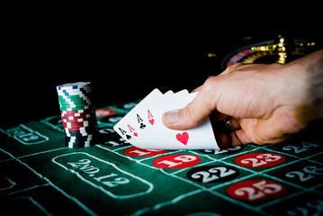 Roulette table and stack of poker chips, Casino, gambling and entertainment concept  photo