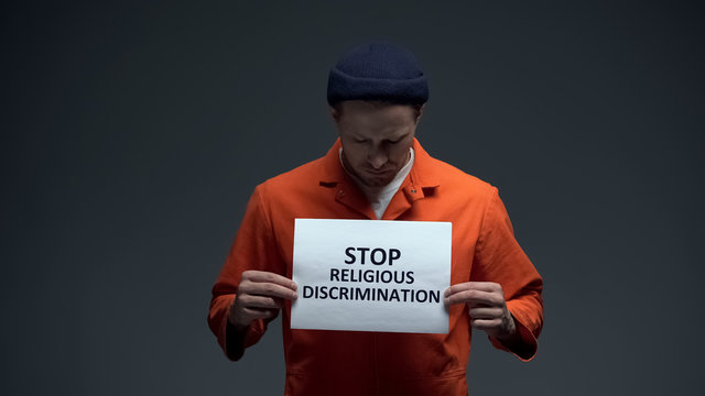 European Male Prisoner Holding Stop Religious Discrimination Sign, Pressure