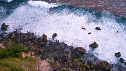 Rock and ocean waves photo from top to bottom