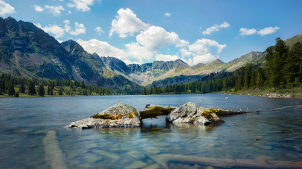 Blue clear lake among the mountains in the summer