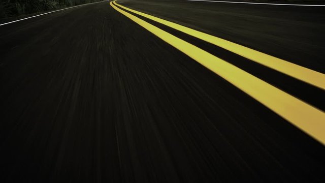 Front pov view of fast car driving on asphalt road