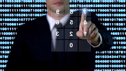 Man entering password on screen, security data base access, modern technology