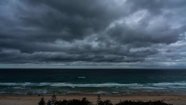 Timelapse of low clouds moving across the ocean and beach