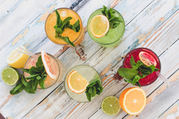 fresh fruit and vegetable juice on wooden background
