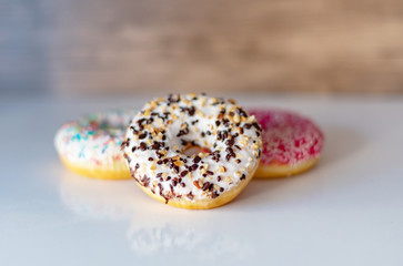 three delicious donuts on white background