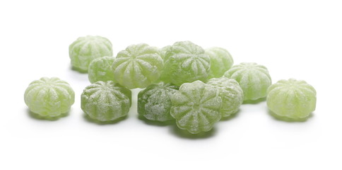 Fototapeta premium Green hard menthol candies isolated on white background
