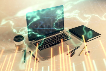 Stock market chart with globe hologram and desktop office computer background. Multi exposure. Concept of financial analysis.