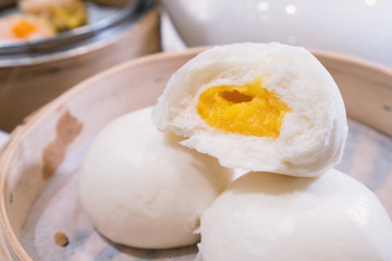 Delicious dim sum, famous cantonese food in asia, fresh and hot salted creamy custard buns in...