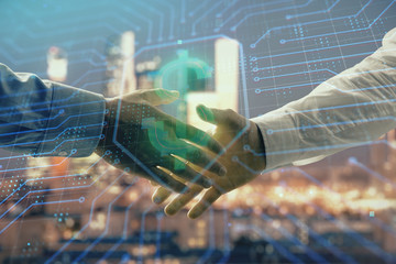 Double exposure of business theme drawing on cityscape background with handshake. Concept of partnership