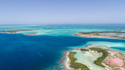 Fototapeta na wymiar isla de locos Caribbean: Vacation in the blue sea and deserted islands. Aerial view of a blue sea with crystal water. Great landscape. Beach scene. Aerial View Island Landscape Los Roques