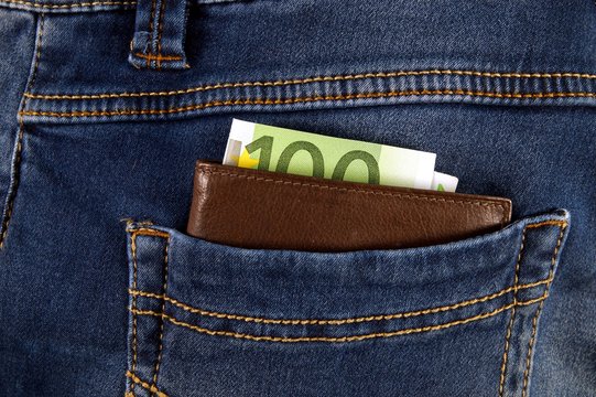 euro money cash, euro banknotes in the leather wallet in the pockets of jeans trousers. banner for web, gift card, postcard. Concept of wealth, saving or spending money. special payment during corona