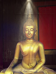 golden buddha statue, The face of gold buddha statue, Close up of the old Thai buddha with wooden...