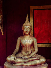 golden buddha statue, The face of gold buddha statue, Close up of the old Thai buddha with wooden wall background in art of religion concept