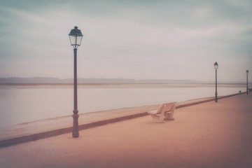 Fototapeta na wymiar Empty romantic promenade along the sea